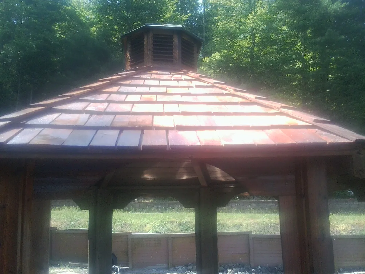 New cedar shake roof and cupola on a lakeside gazebo in Fostoria